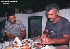 Yiorgos and Panayiotis Sharing Meze of Fresh Octopus and Mountain Snails