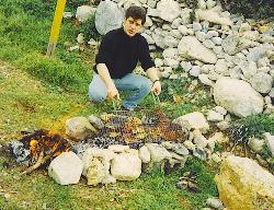Makis Grilling Fresh Octopus in Elounda, Crete